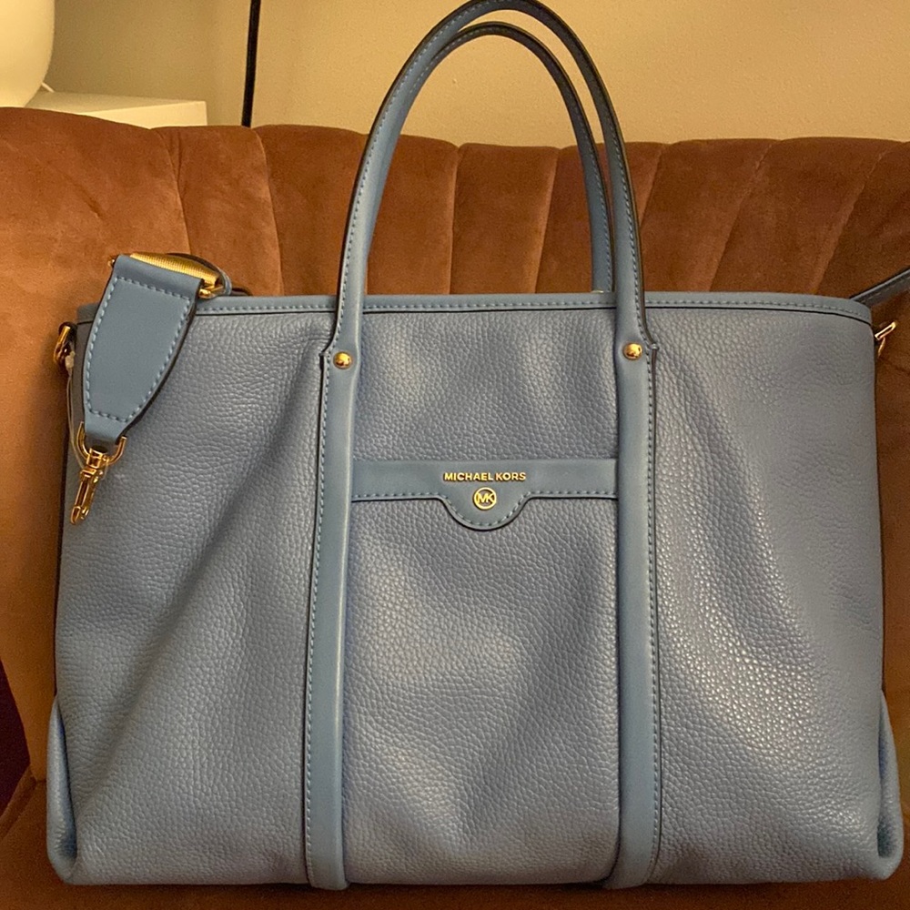 Michael Kors light blue tote bag have a handles and long strap